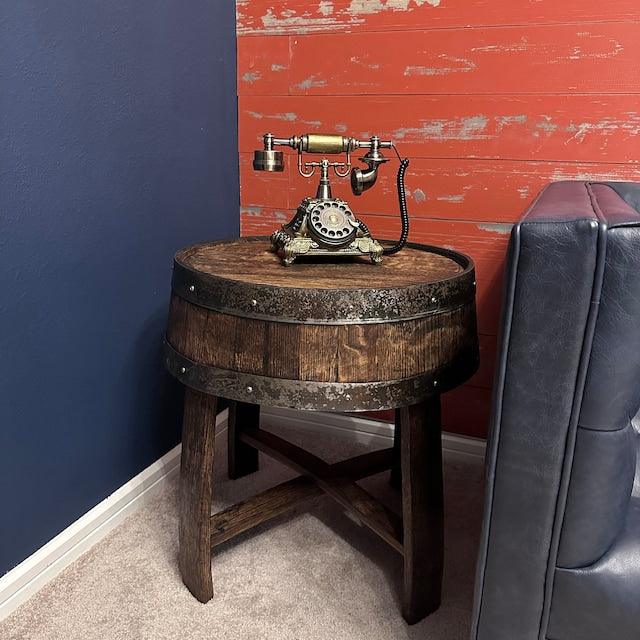 Vintage rotary phone on a rustic barrel side table adds a touch of retro elegance to a room with contrasting red and blue walls. Perfect for cozy, stylish interiors. #VintageDecor #HomeStyle #RetroPhone #InteriorDesign