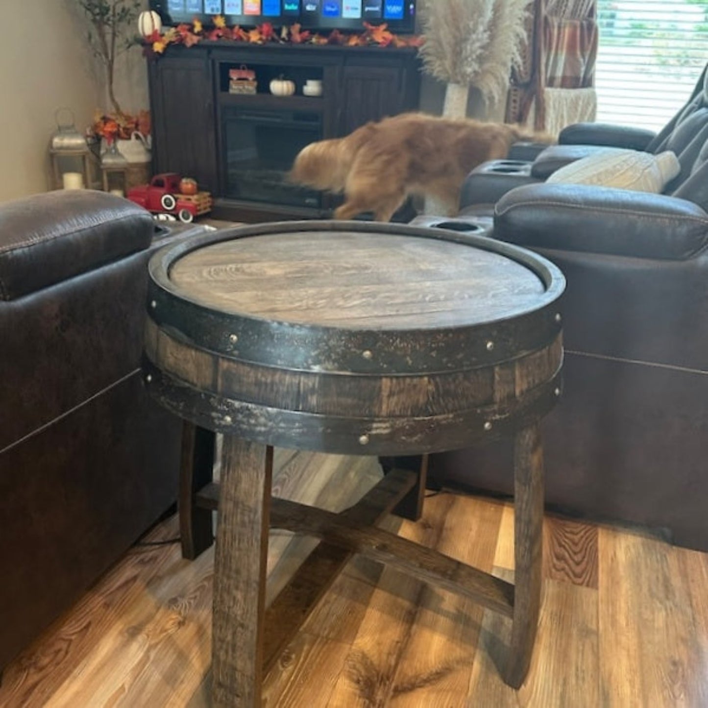 Cozy living room with rustic wooden table, leather sofas, and a blurred cat in motion, conveying a warm, homey atmosphere, perfect for relaxed interior design inspiration. #HomeDecor #RusticStyle #CozyLivingRoom