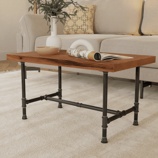 Elegant industrial-style coffee table featuring a rich wooden top and sturdy pipe metal frame, complemented by a cream sofa and chic decor, perfect for modern living spaces. #InteriorDesign #HomeDecor #LivingRoomInspiration