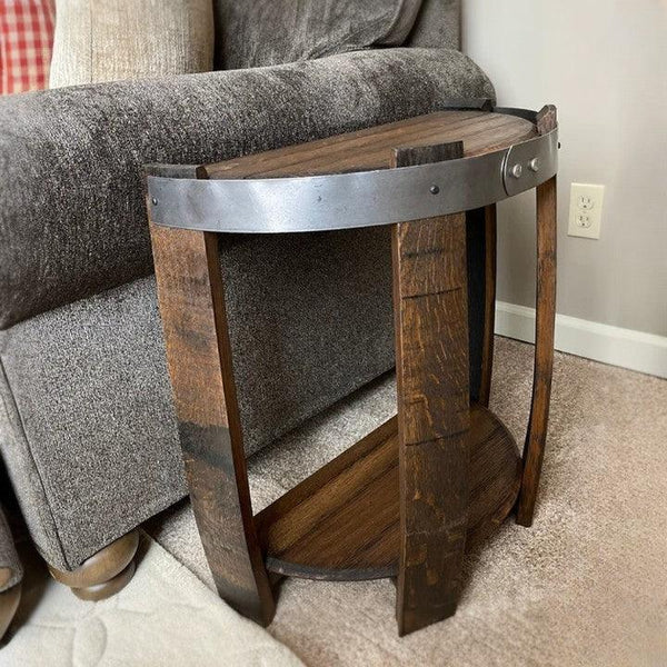 Rustic wooden side table with metal accents, nestled against a gray fabric sofa, adds a touch of industrial charm to home decor. Perfect for small spaces.