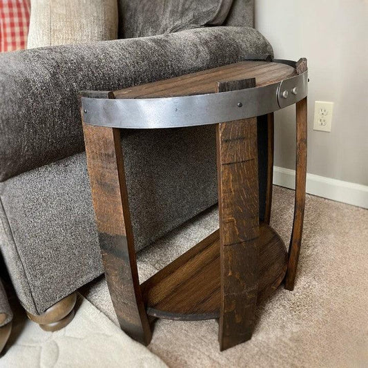 Rustic wooden side table with metal accents, nestled against a gray fabric sofa, adds a touch of industrial charm to home decor. Perfect for small spaces.