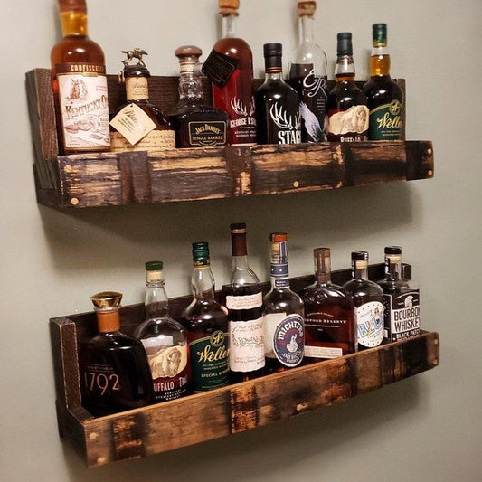Rustic wooden shelves display an assortment of premium whiskey bottles, enhancing home bar decor with a touch of vintage charm. Ideal for whiskey enthusiasts.